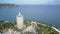 Aerial view huge pagoda on hill among trees on ocean coast