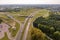 aerial view of huge road junction of freeway with heavy traffic at city