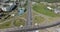 An aerial view of a huge road junction and an industrial urbanscape around it