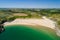 Aerial view of a huge sandy beach and clear waters Broad Haven South, Pembrokeshire, Wales