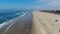 Aerial view of Huntington Pier, beach and coastline during sunny summer day