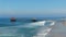 Aerial view of Huntington Pier, beach and coastline during sunny summer day