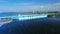 An aerial view a of the hydroelectric power station with cars traffic moving over the bridge and flowing river. 3D