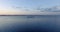 Aerial view of hydrofoil transport ship in lake at golden hour