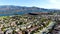 Aerial view of identical residential subdivision house with big lake and mountain on the background