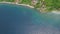 Aerial view of idyllic country village near the tropical blue sea.