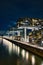 Aerial view of illuminated crane houses by the canal at the Zollhafen in Cologne, Germany at night