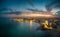 Aerial view of illuminated seaside cityscape of Porto Cesareo in Italy during sunset