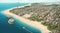 Aerial view illustration of a beautiful beach and city during the day with many tall buildings, hotels, roads and cruise ships