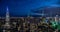 Aerial view of the impressive skyline of New York city at night, illuminated by numerous lights