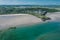 Aerial view of Inchydoney beach near Clonakilty in Ireland with people in the turquoise water