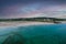 Aerial view of Inchydoney beach near Clonakilty in Ireland with people in the turquoise water