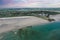 Aerial view of Inchydoney beach near Clonakilty in Ireland with people in the turquoise water