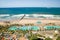 Aerial view of Indian Ocean, white sandy beaches, pool and ocean pier in the town center of Durban, South Africa