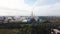 Aerial view of industrial area with chemical plant. Stock footage. Smoking chimney of the factory located near the city