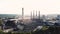 Aerial view of industrial area with chemical plant. Stock footage. Smoking chimney of the factory located near the city