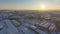 Aerial View of Industrial City under White Snow on Sunrise