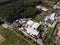 Aerial view of industrial factory complex in a green landscape