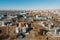 Aerial view of industrial factory or plant buildings with steel storage construction tanks and pipes, oil refinery concept