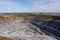 Aerial view industrial of opencast mining quarry with lots of machinery at wo