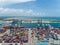 Aerial view of the industrial port with containers,  Large container vessel unloaded in Port. Cargo Ship Loading,
