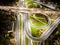 Aerial view interchange ring road and motorway freeway highways and moving headlight cars transportation with over lighting the