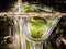 Aerial view interchange ring road and motorway freeway highways and moving headlight cars transportation with over lighting the