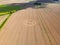 Aerial view of an intricate geometric crop circle formation in a wheat field in Wiltshire, England