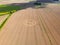 Aerial view of an intricate geometric crop circle formation in a wheat field in Wiltshire, England