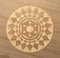 Aerial view of an intricate geometric crop circle formation in a wheat field in Wiltshire, England