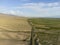 Aerial view of irrigated farmland on the edge of desert in Kyrgyzstan