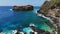 Aerial view of island with rocks, stones and blue ocean