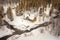 aerial view of an isolated cabin in snowy landscape