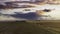 Aerial view of an isolated storm over crop swaths