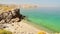 Aerial view isolated tourist woman in bikini walk on white sand beach alone in persian gulf Mirellas island. Musandam.Oman