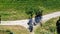 Aerial view of italian countryside with pattern drawn by roads, meadows and trees