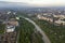 Aerial view of Ivano-Frankivsk city with residential area and suburb houses with a river in middle