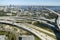 Aerial view of Jacksonville city with high office buildings and american freeway intersection with fast driving cars and