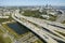 Aerial view of Jacksonville city with high office buildings and american freeway intersection with fast driving cars and