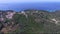 Aerial view of kaiser`s throne in Greek island of Corfu,a hill with trees and a throne on top,  backward movement by drone,