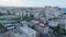 Aerial view of Karaalioglu Park, relax in urban borough. Rising reveal of multistorey apartment of hotel buildings in