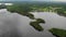 Aerial view karst lake in Novgorod oblast. Nice nature with village shore Summer