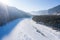 Aerial view of Katun river in winter. River covered by ice and snow in winter