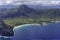 Aerial view of Kauai south coast showing mountains, beach and rugged coastline near Poipu Kauai Hawaii USA