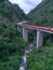 Aerial view of Kelok 9 bridge at dusk. A popular bridge in Sumatra to commute between cities