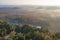 Aerial view of Khao Na Nai pagoda stupa. Luang Dharma Temple Park with green mountain hills and forest trees, Surat Thani,