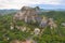 Aerial view of Khao Ngu Stone. National park with river lake, mountain valley hills, and tropical green forest trees at sunset in