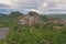 Aerial view of Khao Ngu Stone. National park with river lake, mountain valley hills, and tropical green forest trees at sunset in