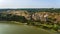 Aerial view of Khotyn medieval castle on the green hill above the river.