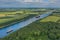 Aerial view of Kiel Canal with container ship and traditional sailing vessel.Container cargo ship and tall ship on the Kiel Canal